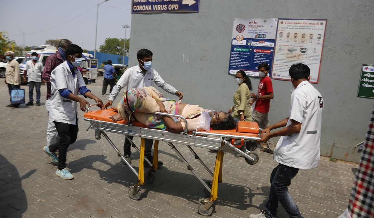 India tops 200,000 dead as virus surge breaks health system