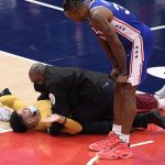 Fan runs onto court at Capital One Arena during Wizards-76ers game