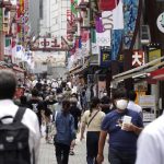 Japan expands coronavirus emergency after record spikes amid Olympics