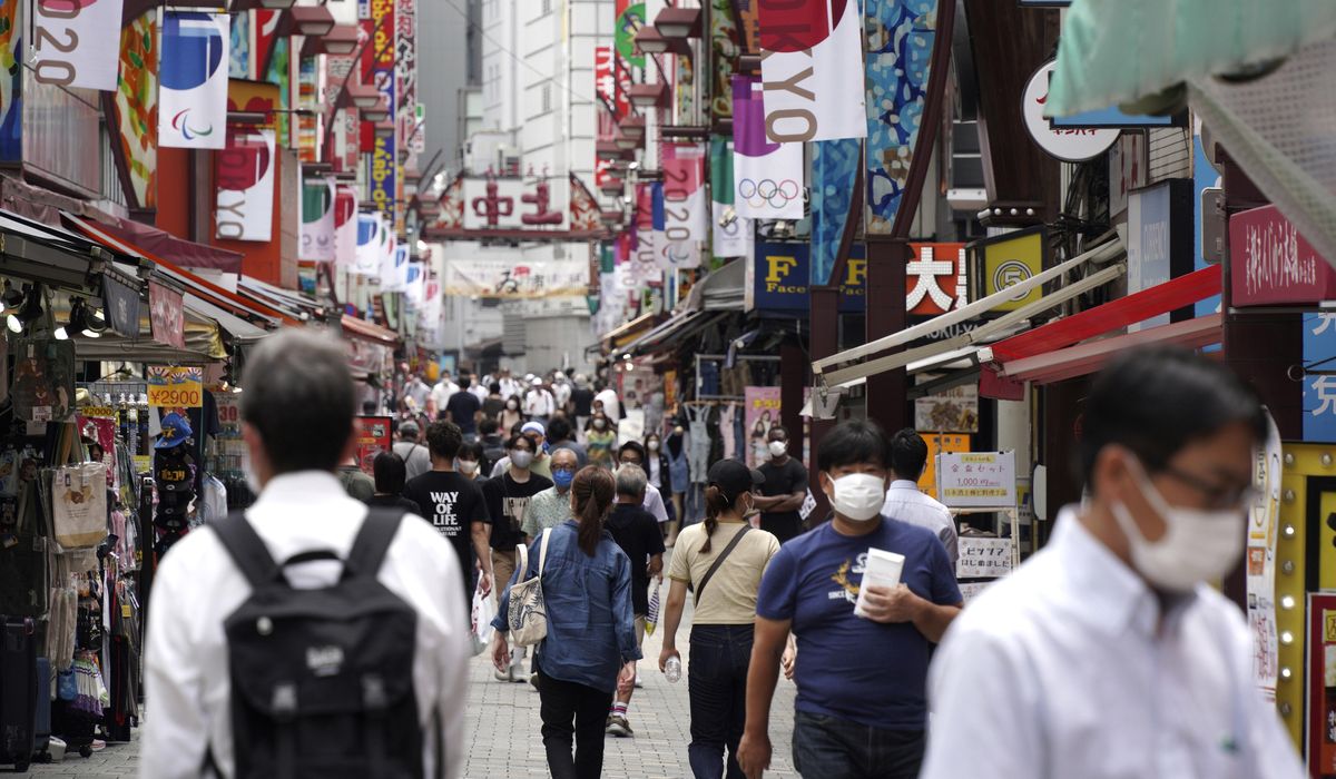 Japan expands coronavirus emergency after record spikes amid Olympics