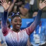 Biles returns to competition with a bronze medal and a smile