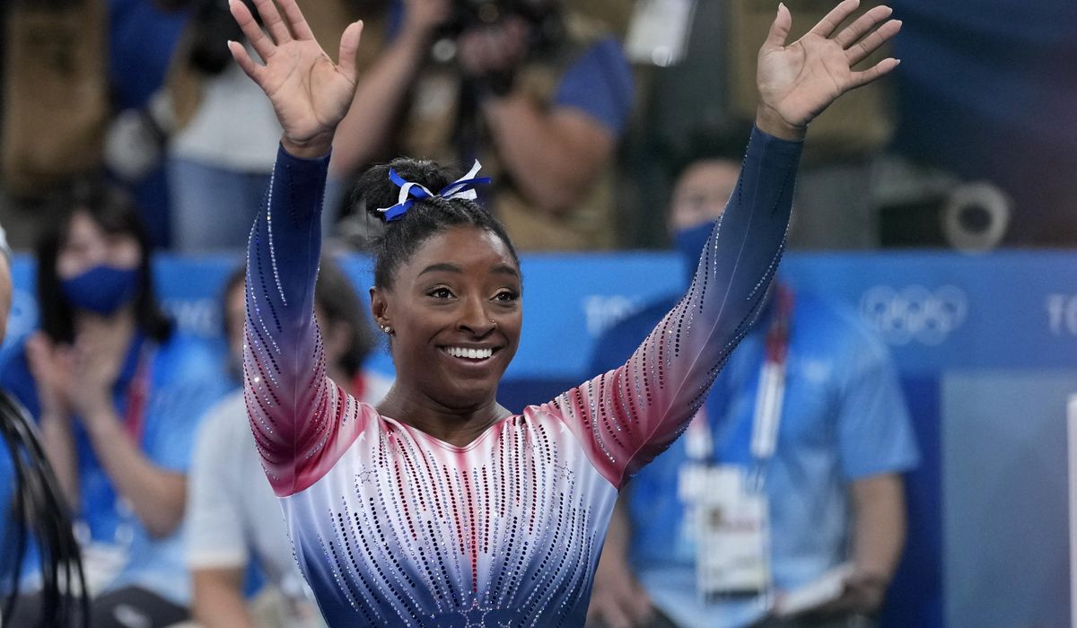 Biles returns to competition with a bronze medal and a smile