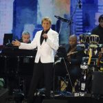 Henri cuts short Manilow set at NYC virus recovery concert