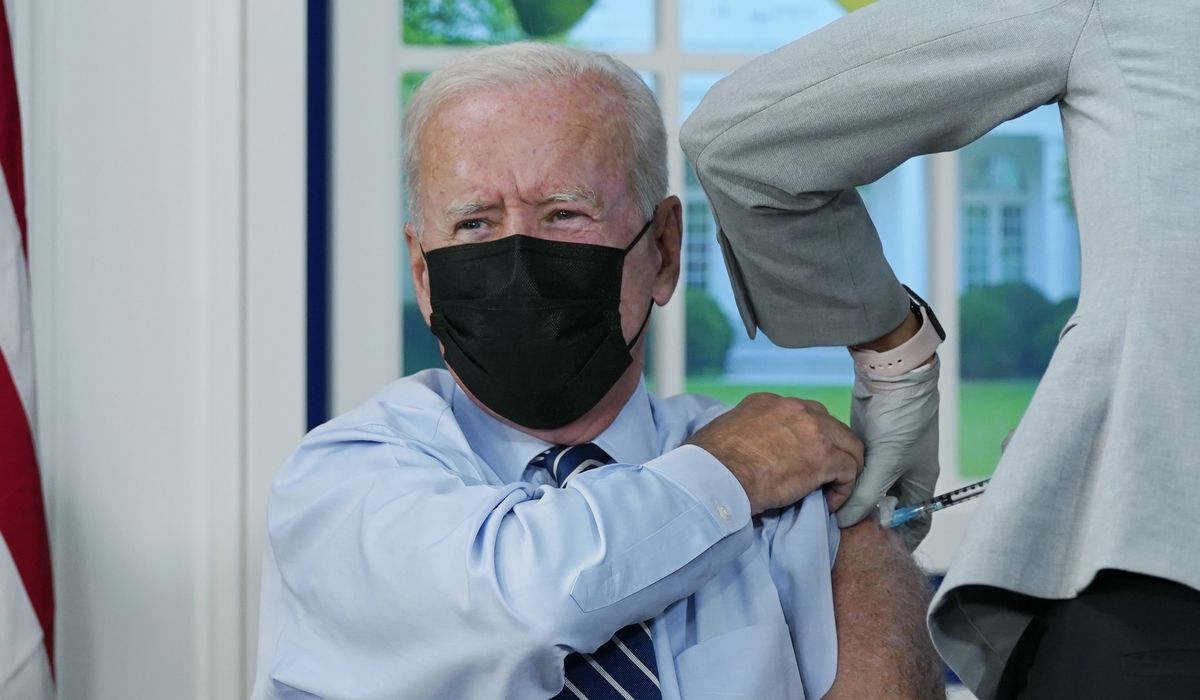 Joe Biden gets a COVID-19 booster shot in front of cameras