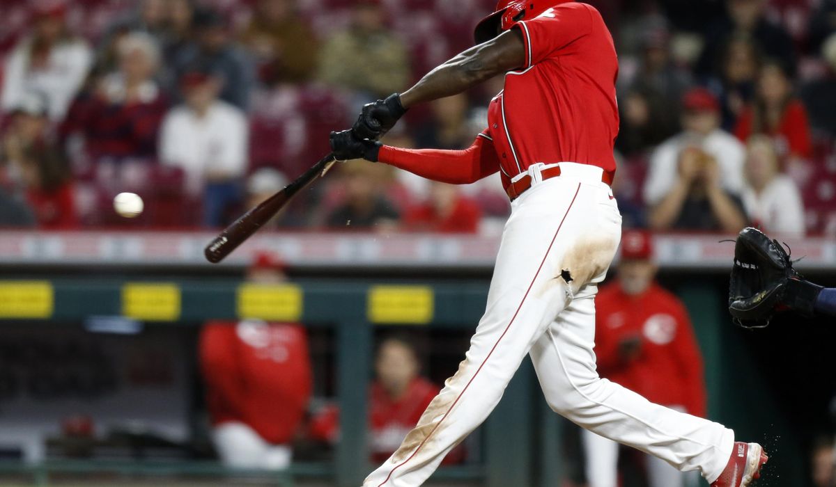 Reds beat Nationals 8-7 in 11 but fall further behind Cards