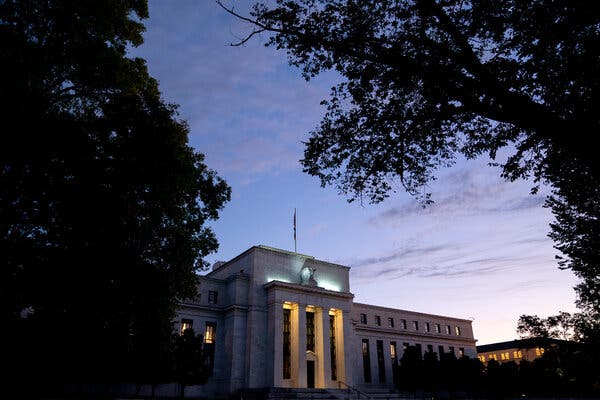 Fed announces new curbs on trading by central bank officials following criticism of ethics rules.