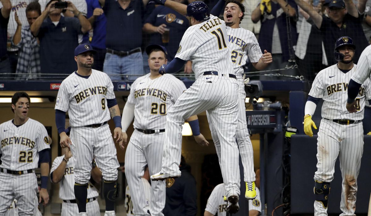 Tellez HR, throw spark Brewers over Braves 2-1 in Game 1