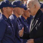 Biden issues Thanksgiving message, visits Coast Guard