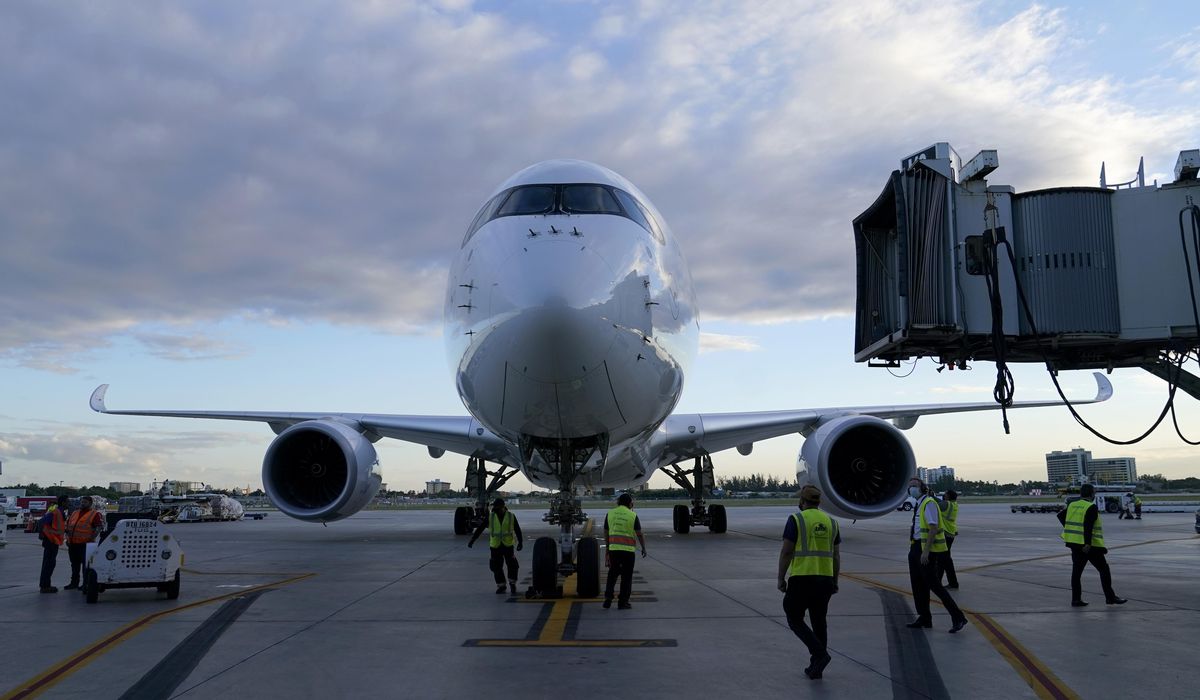 Omicron grounds thousands of holiday flights