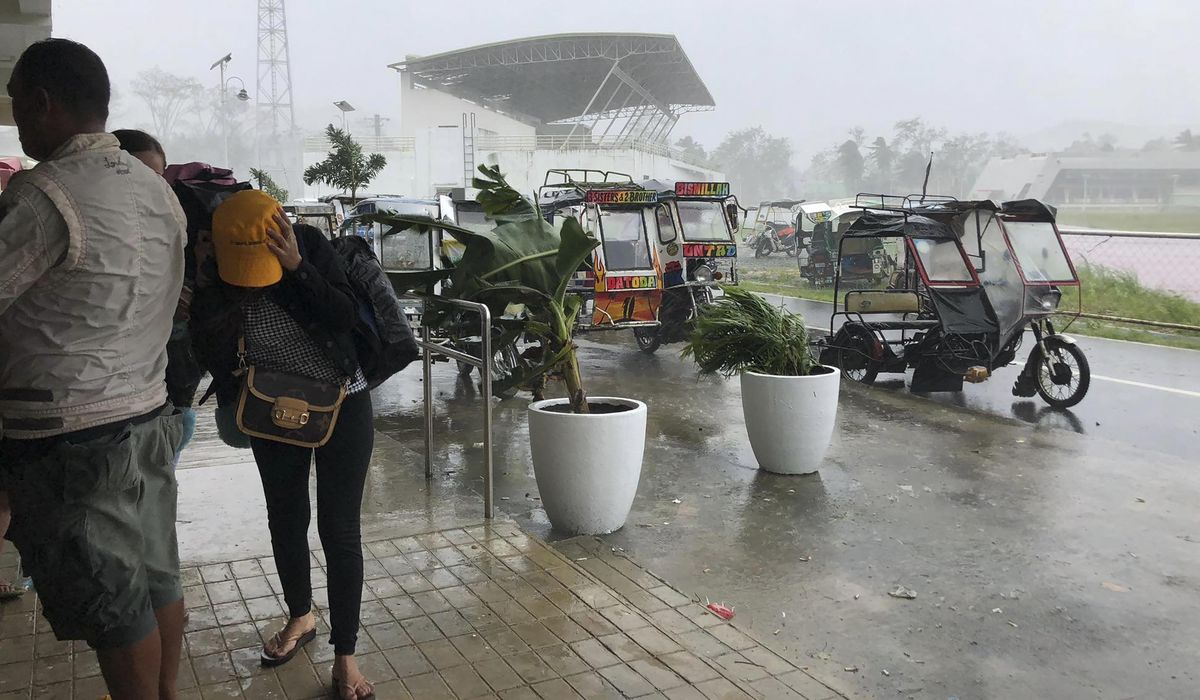 Powerful typhoon hits Philippines; nearly 100,000 evacuated