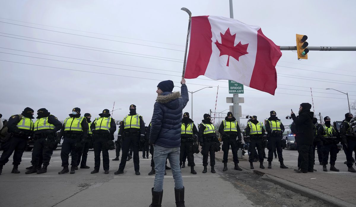 Canadian police seize weapons, arrest 13 at border crossing amid truckers blockade